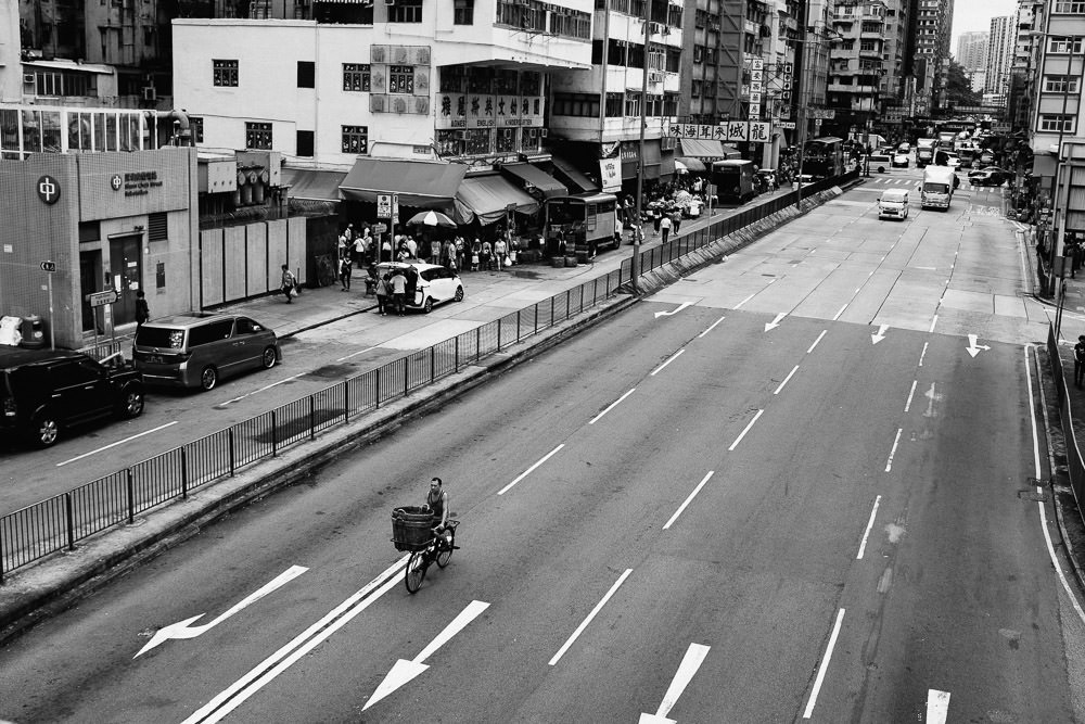 Bicycle rider on road in Hong Kong